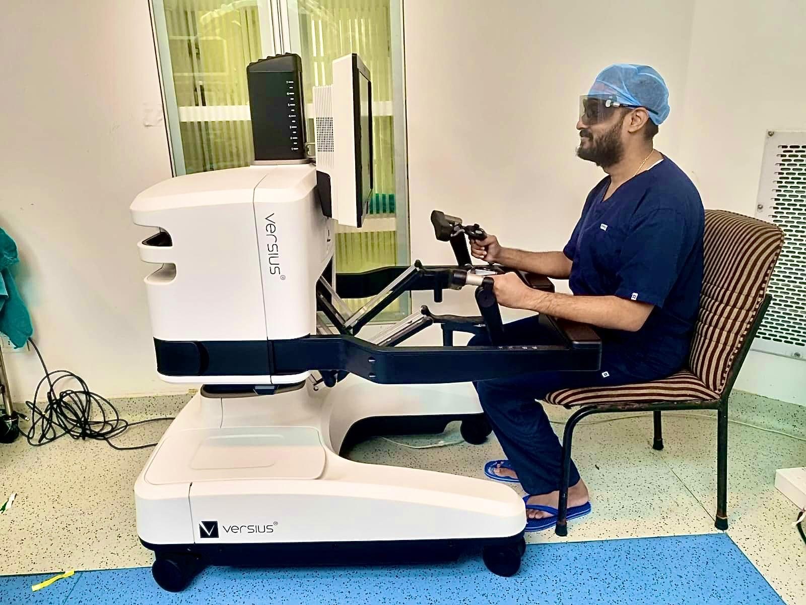 Dr. Ghanshyam Hatwar operating a robotic surgical console in theatre